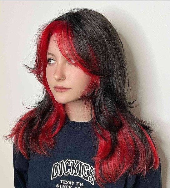 Long Wolf Cut With Bright Red Highlighted Curtain Bangs and Red Ends